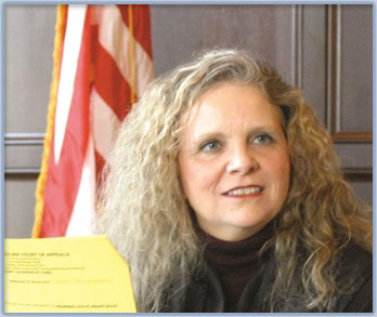 Photo of Judge Martha Geer sitting on the bench in her courtroom